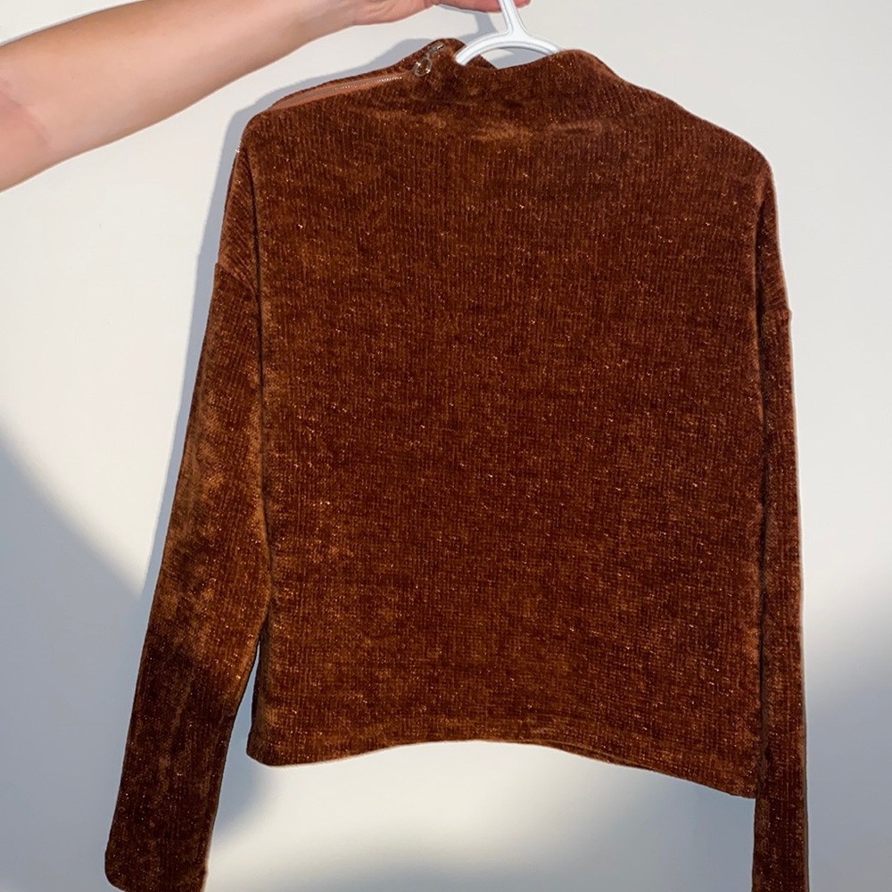 Turtle neck sweater.